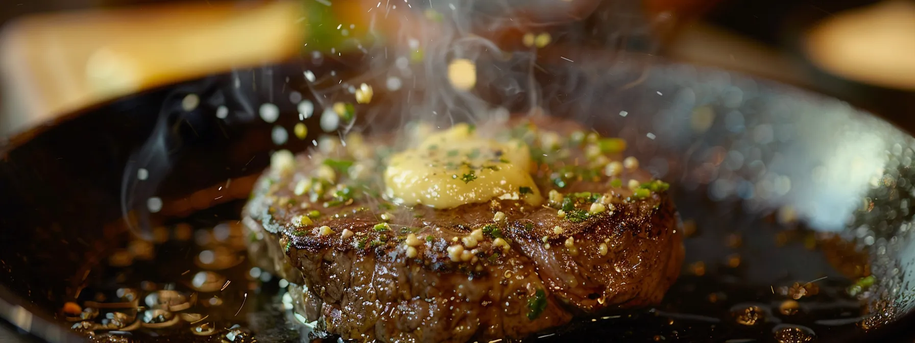 a sizzling round steak covered in garlic butter melting on a hot skillet.