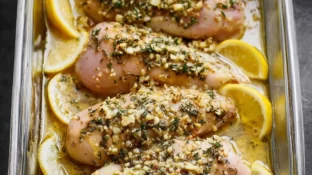 Delicious Greek chicken marinade in a bowl with herbs and spices