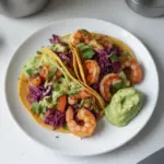 SPICY SHRIMP TACOS WITH AVOCADO CREMA